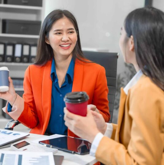 two-asian-business-woman-work-on-a-laptop-in-an-of-2025-02-15-16-08-53-utc (1) Two Asian Business Woman