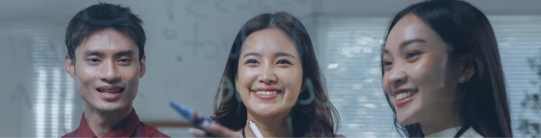 Increased Performance Team of professionals collaborating on a strategy using a glass board to drive innovation and increased performance in the workplace.