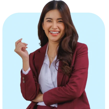 Talent Acceleration Program Integrated Development Program terpadu di Indonesia - wanita profesional muda berblazer merah tersenyum percaya diri siap berkembang melalui pengembangan karir dan kompetensi holistik